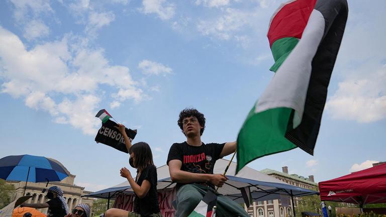 A protester holds a Palestinian flag as anti-Israel agitators rally on the Columbia University campus at a protest encampment despite a 2 p.m. deadline issued by university officials to disband or face suspension, during the ongoing conflict between Israel and the Islamist terrorist group Hamas, in New York City, U.S., April 29, 2024. Reuters