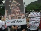 art.obama.protest.sign.cnn[1].jpg