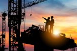 silhouette-engineer-worker-checking-project-building-site-background-construction-sunset-eveni...jpg