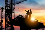 silhouette-engineer-worker-checking-project-building-site-background-construction-sunset-even...webp