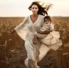 woman-her-baby-are-running-field-with-sun-them_783884-26152[1].webp