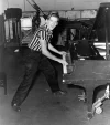 Jerry-Lee-Lewis-standing-playing-piano-circa-1950s-60s[1].webp
