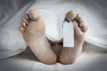closeup-feet-corpse-covered-sheet-600nw-2114079326[1].webp
