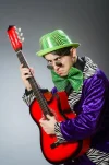 funny-man-playing-guitar-musical-concept-61200390[1].webp
