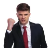 portrait-angry-businessman-shaking-his-fist-white-background-wears-navy-coloured-suit-red-tie...webp