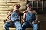 two-elderly-hillbillies-gossiping[1].webp