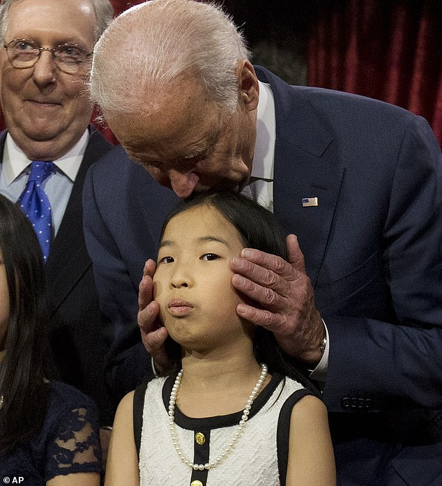 11788442-11318091-Vice_President_Joe_Biden_kisses_a_niece_of_incoming_Senate_Major-m-6_1665809716835.jpg