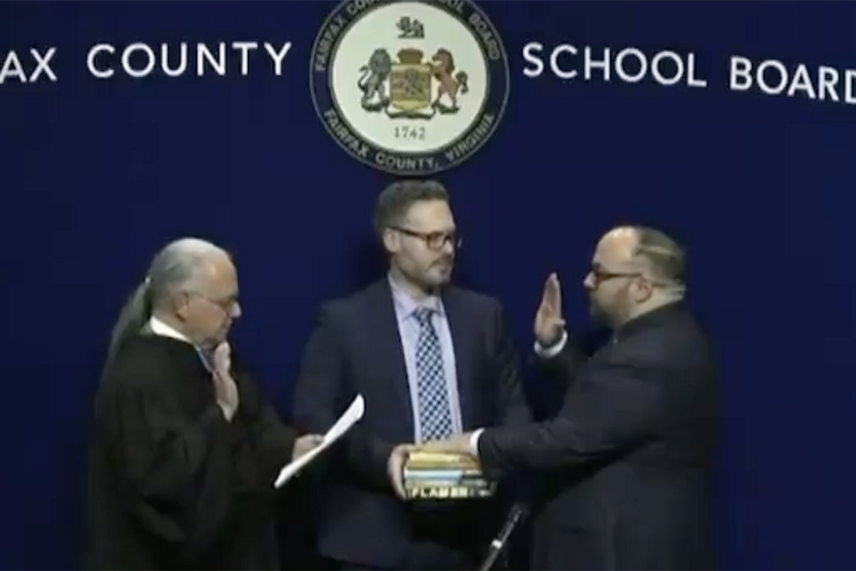 Watch: New chairman gets sworn in on stack of porn he wants in school libraries because this is what progressives do now